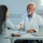 happy-mature-doctor-his-female-patient-shaking-hands-after-medical-appointment-clinic